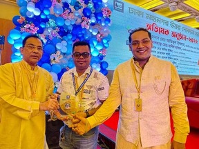 MAK Group BD receiving crest at Dhaka Mohanagar Uttar business event